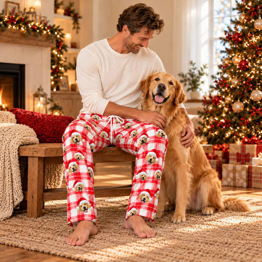 Custom Christmas Pajama Pants - Red Plaid, worn by a model relaxing with a pet in a warm home.